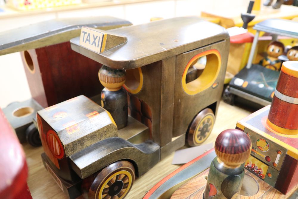 A collection of hand-crafted painted wooden toys, 1980s,